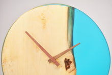 Load image into Gallery viewer, Sky blue transparent epoxy resin with oak hanging wall clock, 30 cm diameter.