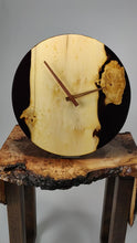Load and play video in Gallery viewer, Black transparent epoxy resin with pippy oak hanging wall clock 30 cm diameter.
