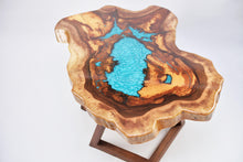 Load image into Gallery viewer, Round sliced walnut resin coffee table with unique cracks and holes inlays in turquoise colour
