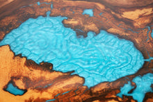 Load image into Gallery viewer, Round sliced walnut resin coffee table with unique cracks and holes inlays in turquoise colour
