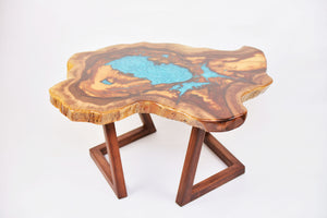 Round sliced walnut resin coffee table with unique cracks and holes inlays in turquoise colour