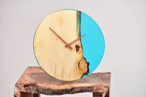 Sky blue transparent epoxy resin with oak hanging wall clock, 30 cm diameter.