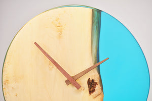 Sky blue transparent epoxy resin with oak hanging wall clock, 30 cm diameter.